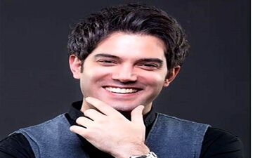 بوسه عشق امیرعلی نبویان بر دستان همسرش در انظار عمومی|عکسی عاشقانه از امیرعلی نبویان و همسرش