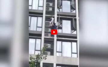 لحظه نجات کودک آویزان از طبقه هفتم آپارتمان! + فیلم