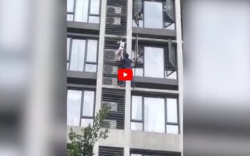 لحظه نجات کودک آویزان از طبقه هفتم آپارتمان! + فیلم