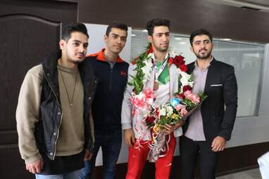 مراسم استقبال از احمد سجادی نفر سوم مسابقات آسیا در فرودگاه كرمانشاه
